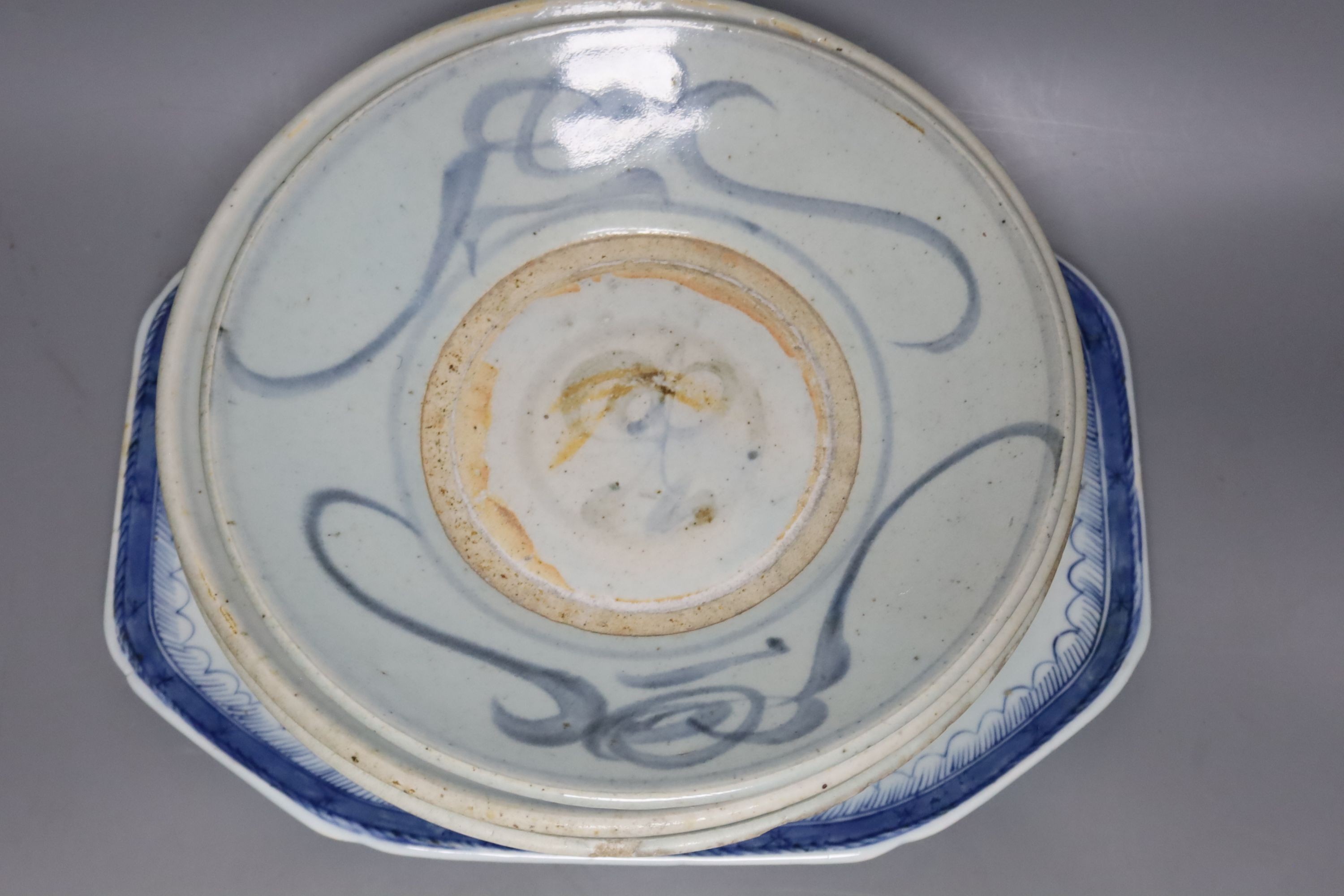 Two 19th century Chinese blue and white dishes and various jars and brush pots, largest item meat platter 33cms wide.